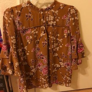 Rustic yellow blouse with floral pattern